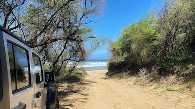 Miles past the end of the state road, you’ll find this beach where the locals camp out.