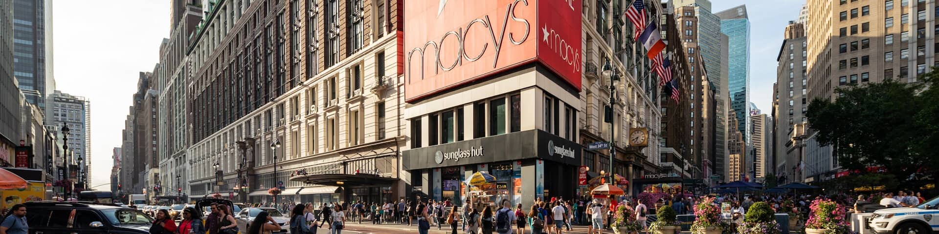 Macy\'s featuring signage, street scenes and a city