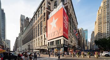 Macy\'s featuring signage, street scenes and a city