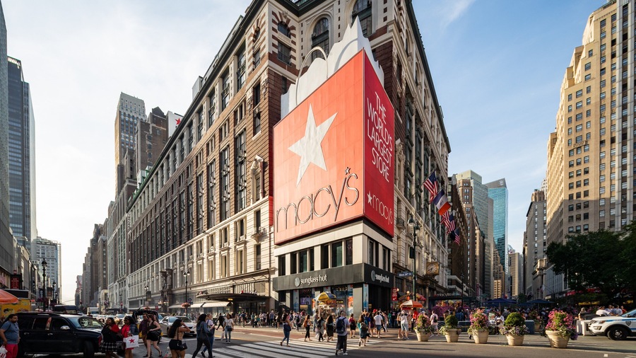 Macy\'s featuring signage, street scenes and a city