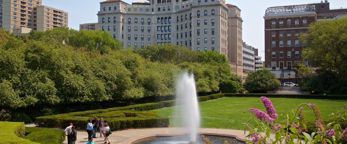 Conservatory Garden featuring a city, a fountain and a garden