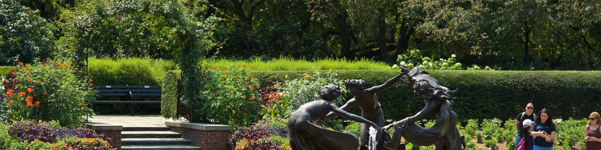 Conservatory Garden featuring a garden, outdoor art and a fountain