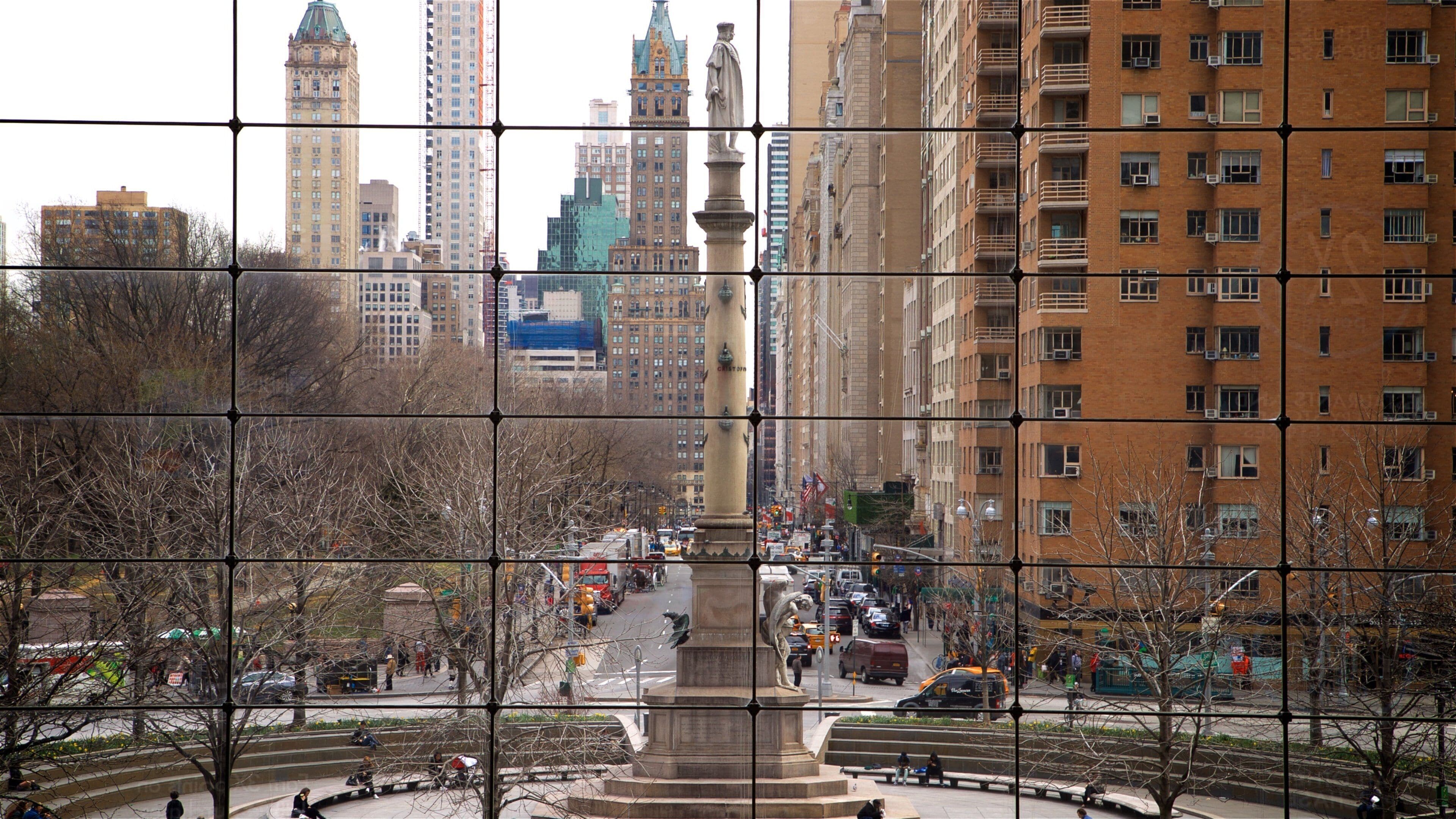 Time Warner Center which includes a city, a high rise building and a statue or sculpture