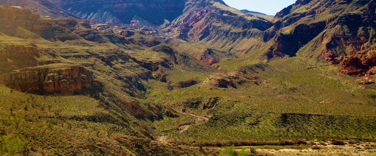 I took this photo at the Virgin River Gorge. In northwest Arizona, USA. This is right off of highway Interstate 15. I was on my way to Zion National Park in Utah when we came upon the Virgin River Gorge. And to tell the truth, when looking through my photos, I didn't even know what it was. I had to do some research later on to find out. 
And more information: Virgin River Gorge is a long canyon that has been carved out by the Virgin River in northwest Arizona. The Virgin River rises on the Colorado Plateau and created the topography of both Zion National Park and the Virgin River Gorge. The Gorge connects the southwestern rim of the Colorado Plateau and the northeastern part of the Mojave Desert. Interstate 15 runs through the canyon and crosses the Virgin River several times. The Virgin River Gorge section of Interstate 15 is one of the most expensive parts of interstate highway ever constructed. Due to the winding of the canyon, the highway within is also noted for its tricky driving conditions.