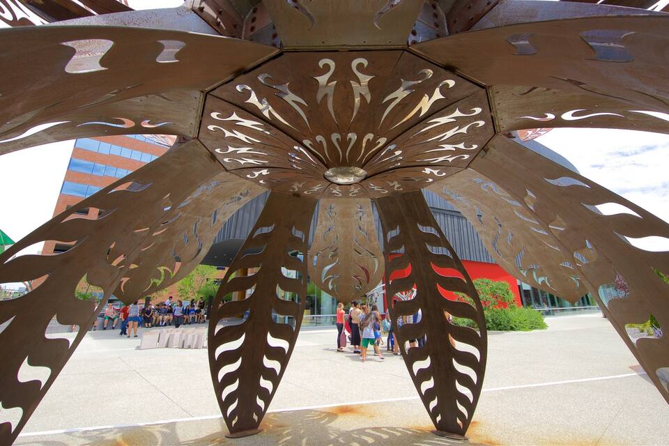 A large metal sculpture with intricate cut-out patterns.