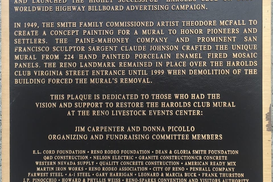 A historical plaque dedicated to the restoration of the Harolds Club mural.