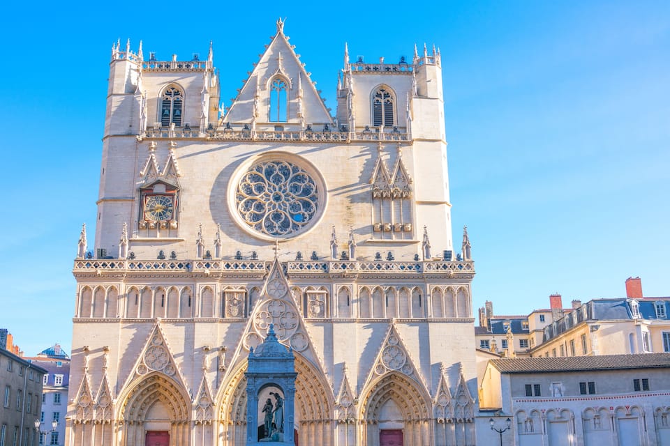 A Gothic cathedral with a large rose window and pointed arches.