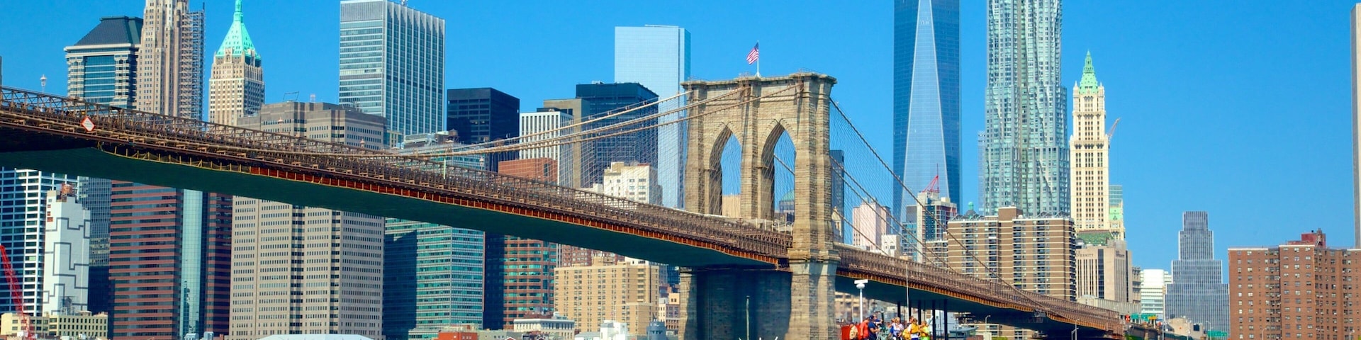 Brooklyn Bridge featuring a ferry, a river or creek and a bridge