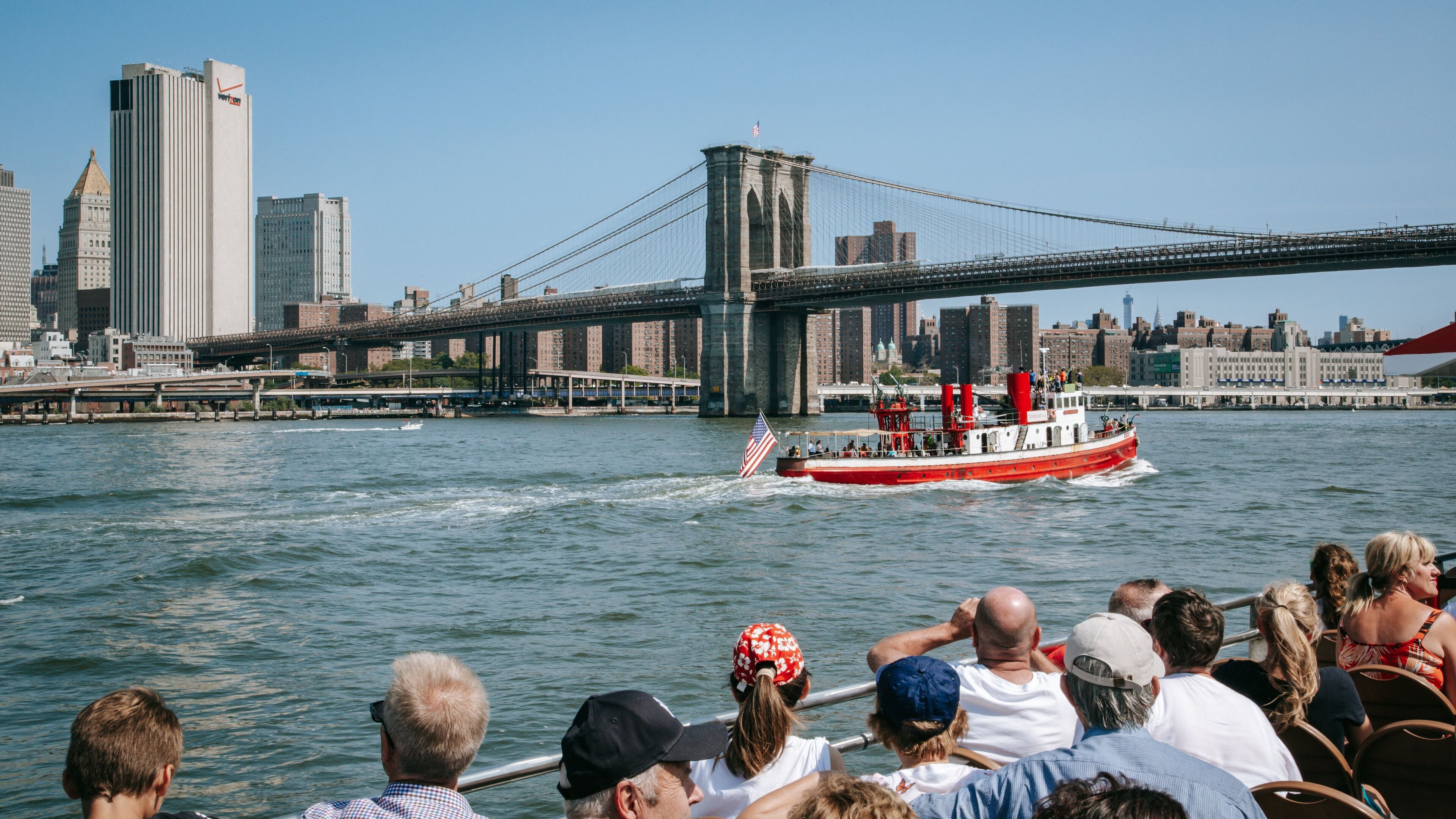 Brooklyn Bridge showing a river or creek, boating and a bridge