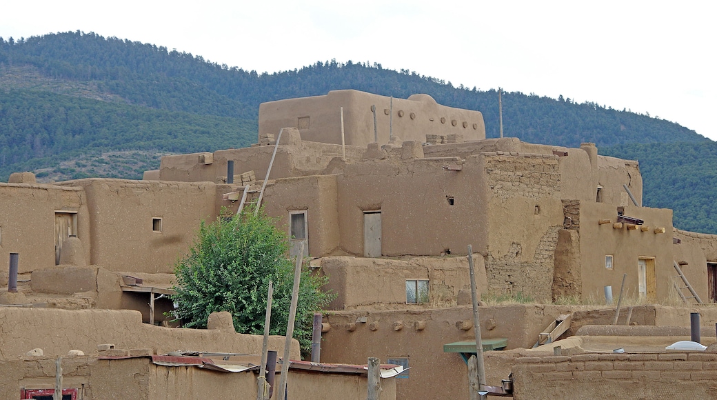 Taos Pueblo (or Pueblo de Taos) is an ancient Pueblo belonging to a Taos-speaking (Tiwa)Native American tribe of Puebloan people,. It lies about 1 mile (1.6 km) north of the modern city of Toas, New Mexico. The pueblos are considered to be one of the oldest continuously inhabited communities in the United States. This has been designated a UNESCO World Heritage Site.