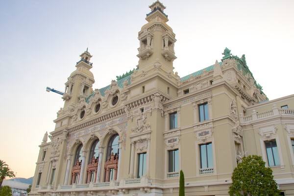 Salle Garnier Opera House which includes a sunset and heritage architecture