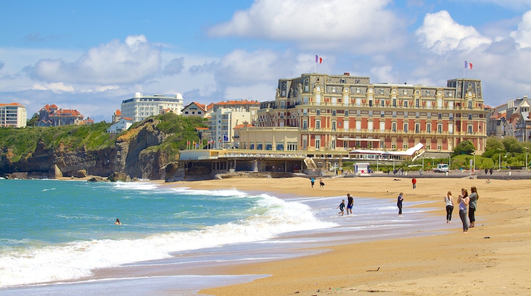 Grand Beach featuring a coastal town and a sandy beach