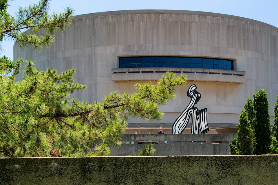 A modern building with a large sculpture of a bird.