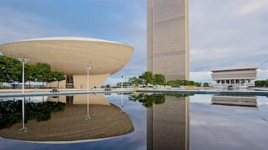 Governor Nelson A. Rockefeller Empire State Plaza showing a high-rise building, a pond and modern architecture