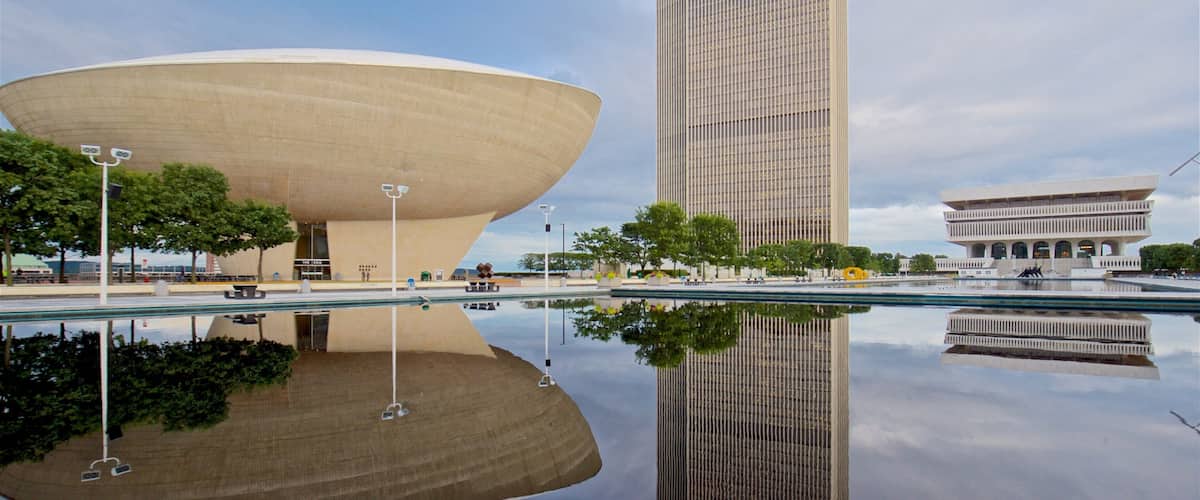 Governor Nelson A. Rockefeller Empire State Plaza which includes a high-rise building, modern architecture and a pond