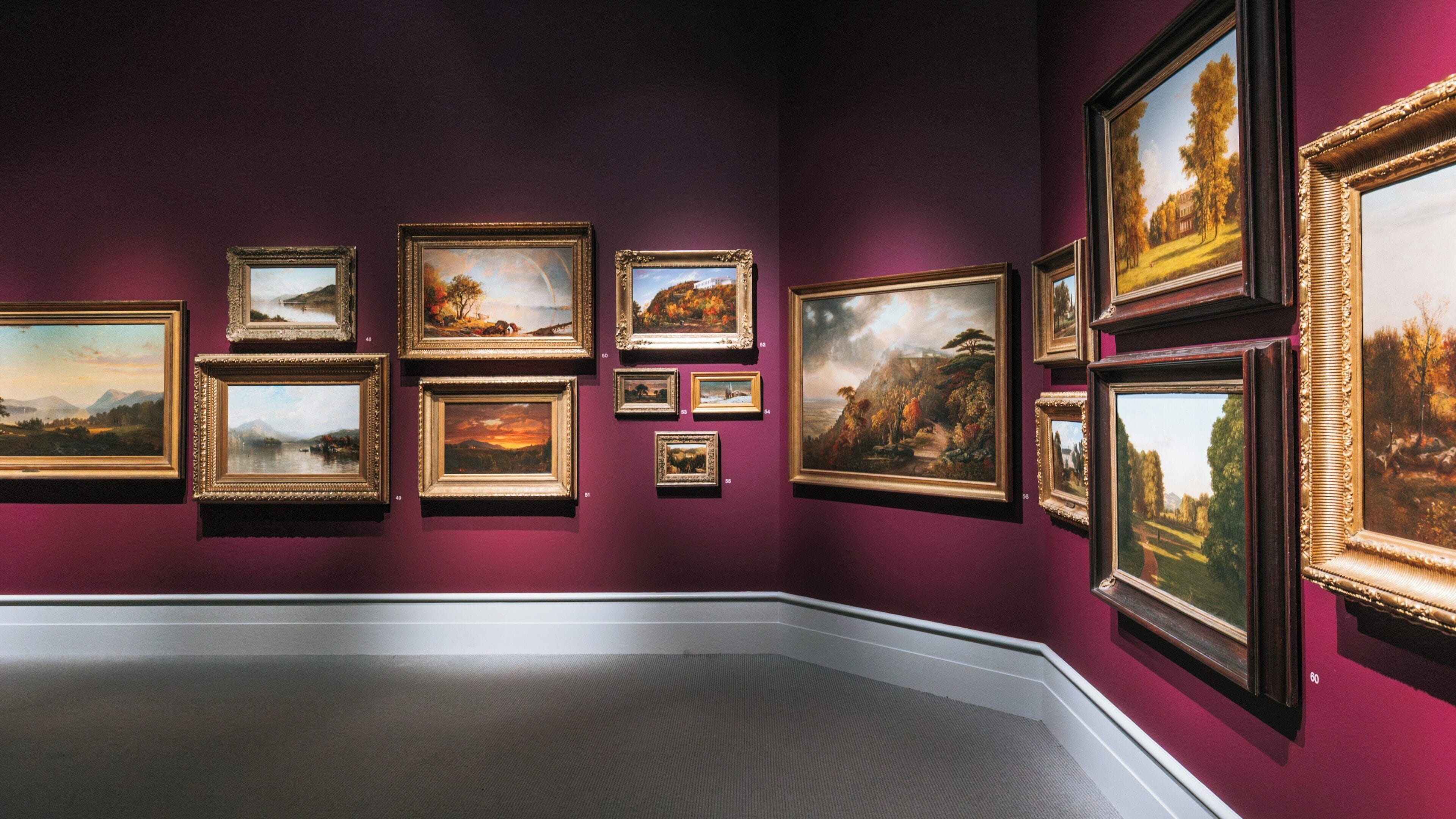Artworks displayed in a rich-hued gallery at Albany Institute of History and Art in Sheridan Hollow, Albany, New York