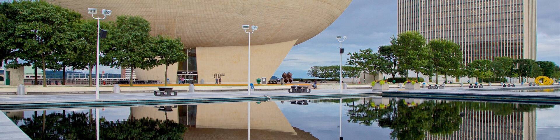 The Egg showing a skyscraper, a pond and modern architecture