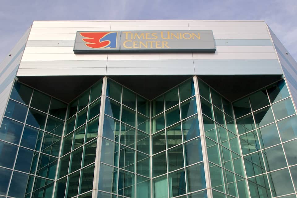 A Times Union Center building with a glass facade and a sign above the entrance.