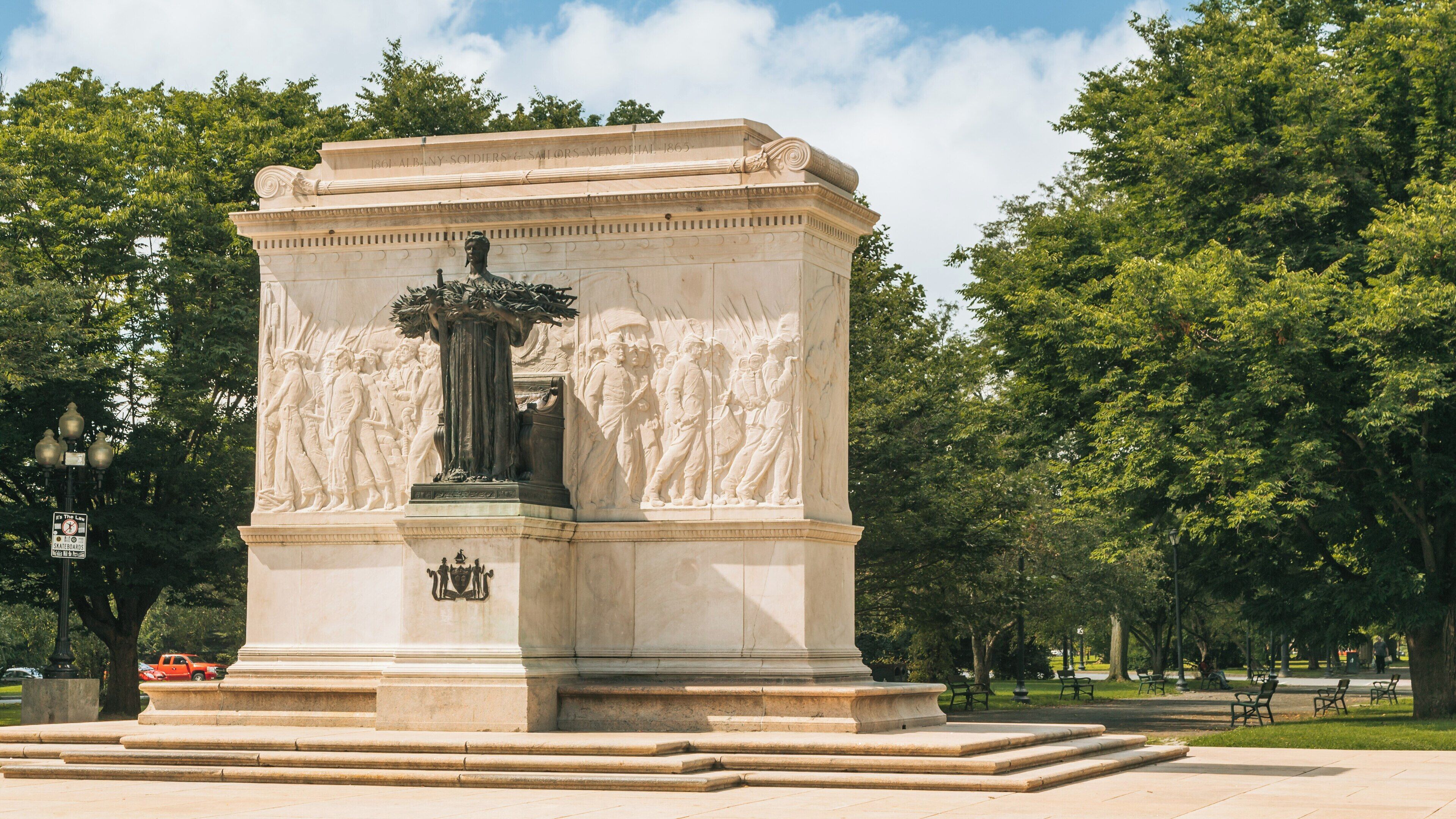 Monument honoring veterans in Washington Park located in Albany, New York, showcasing detailed engravings and a serene atmosphere