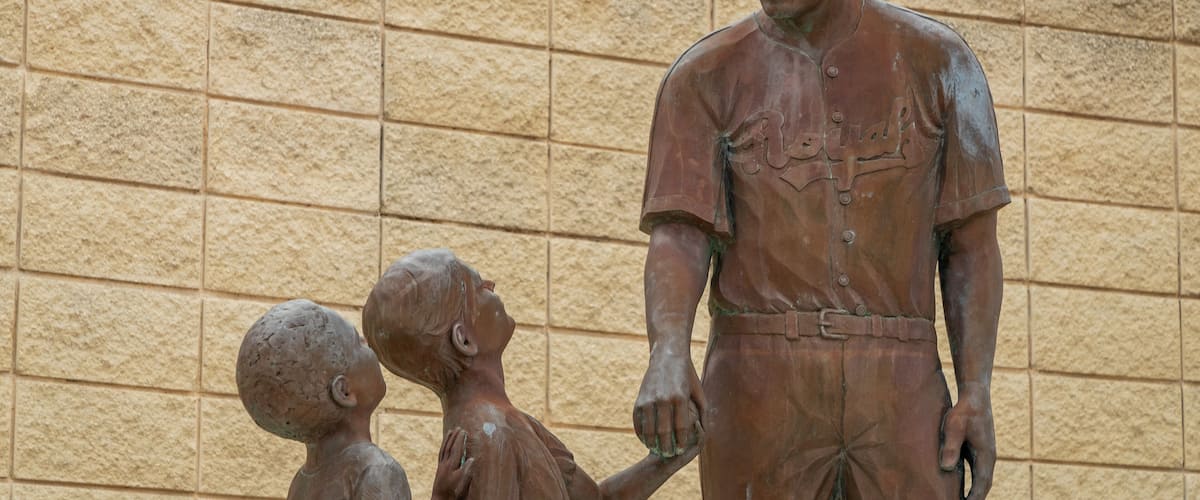 Jackie Robinson Ballpark and Statue featuring a statue or sculpture