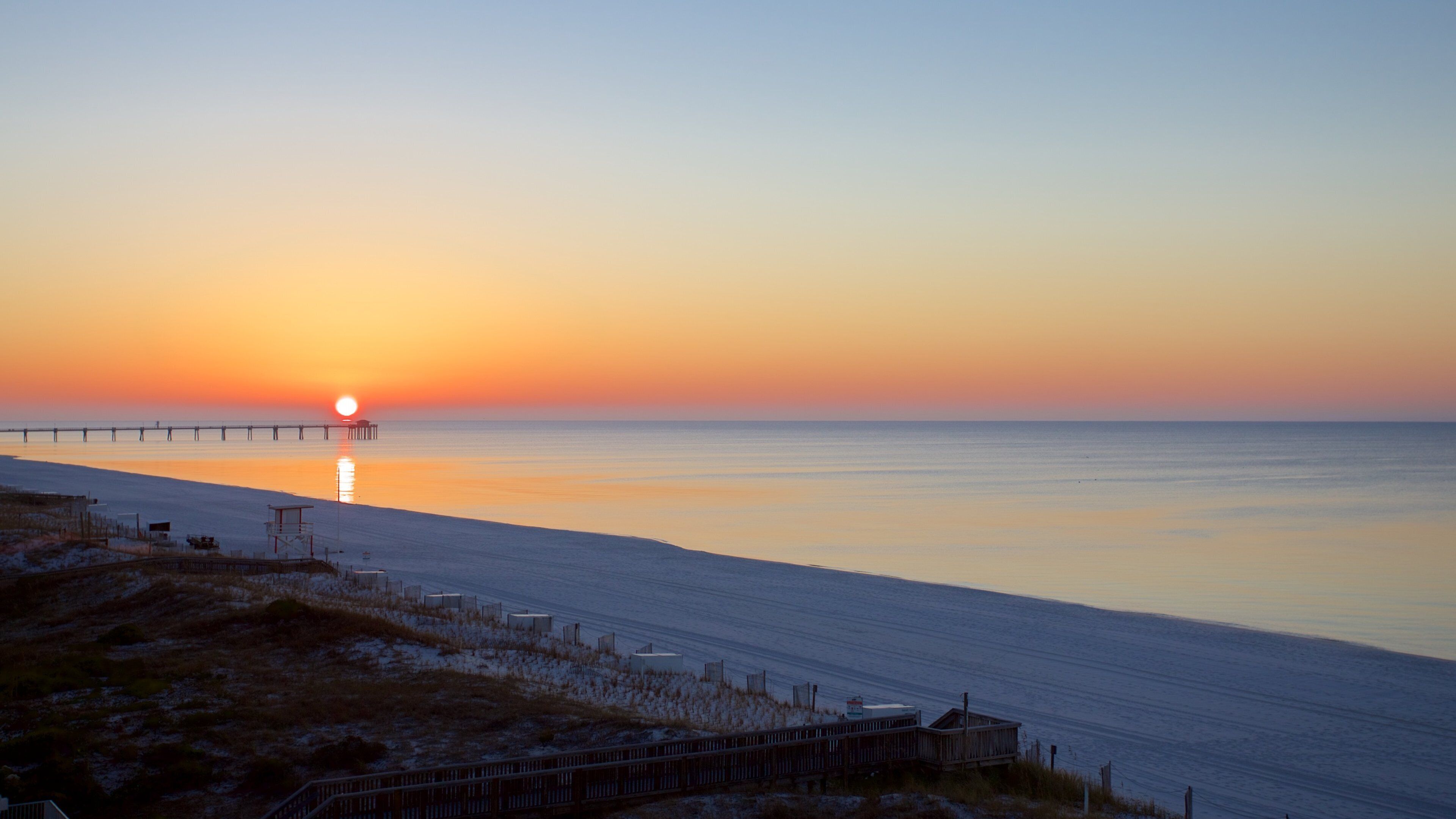 Okaloosa Island showing a sunset and general coastal views