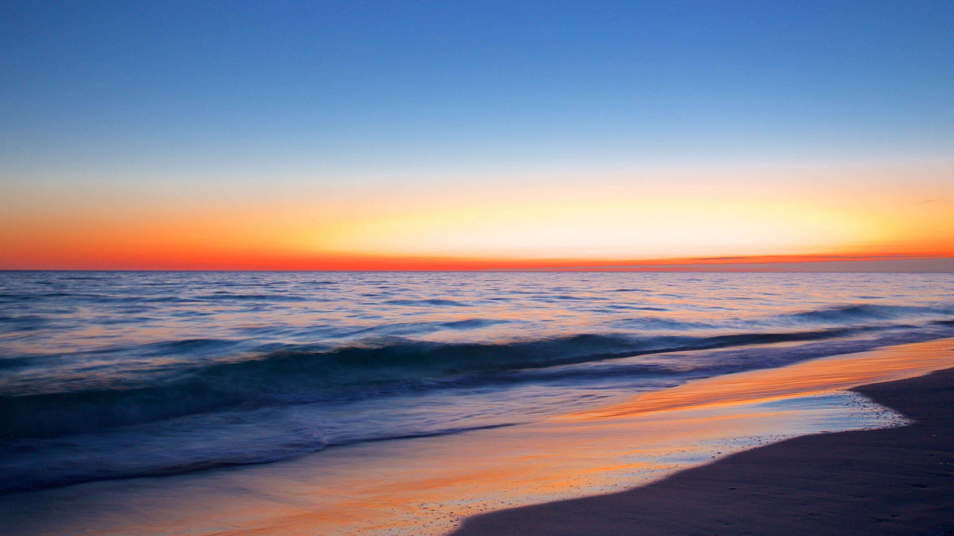 Okaloosa Island showing a sunset and a sandy beach