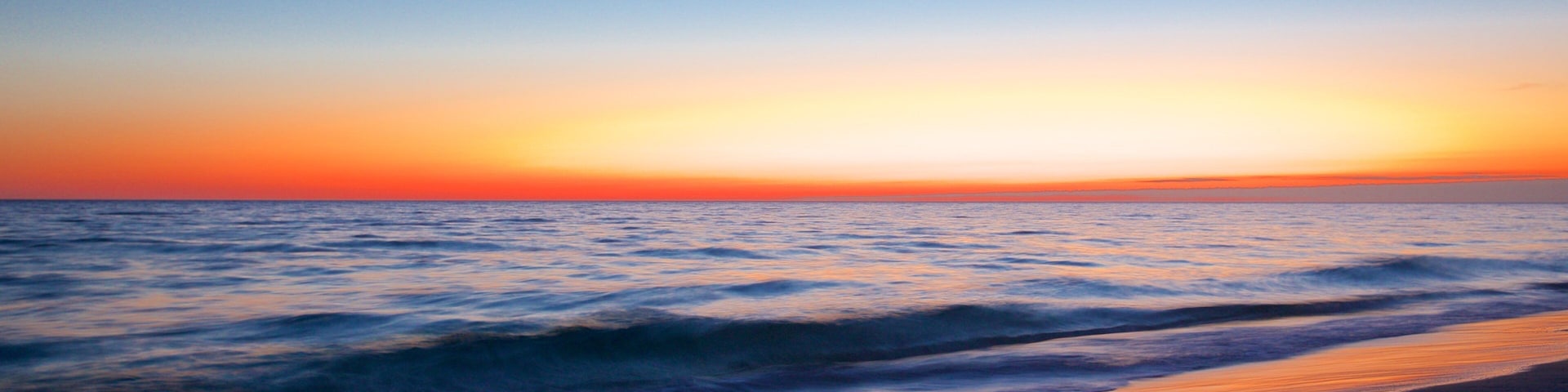Okaloosa Island mostrando un atardecer y una playa