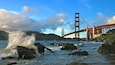 Baker Beach offering stunning views of Golden Gate Bridge and crashing waves along the shoreline in San Francisco