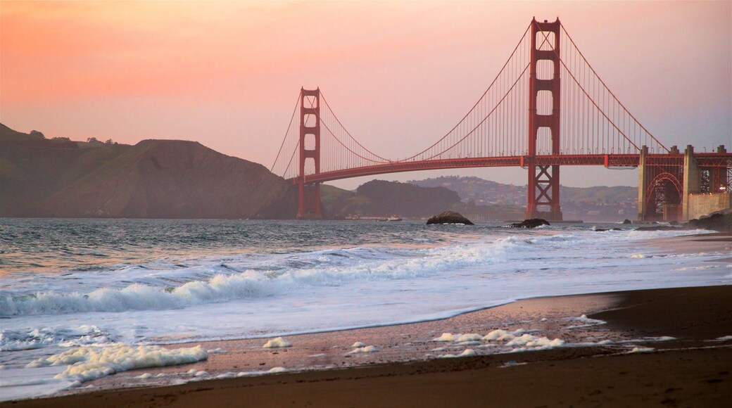 Golden Gate Bridge showing a bridge, a sunset and waves