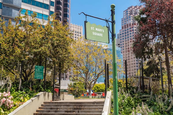 A staircase leading to St. Mary's Square with surrounding trees and buildings.