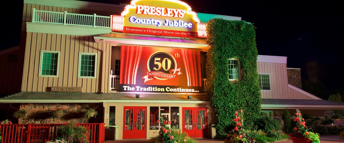 Presley\'s Country Jubilee Theater which includes flowers, night scenes and signage