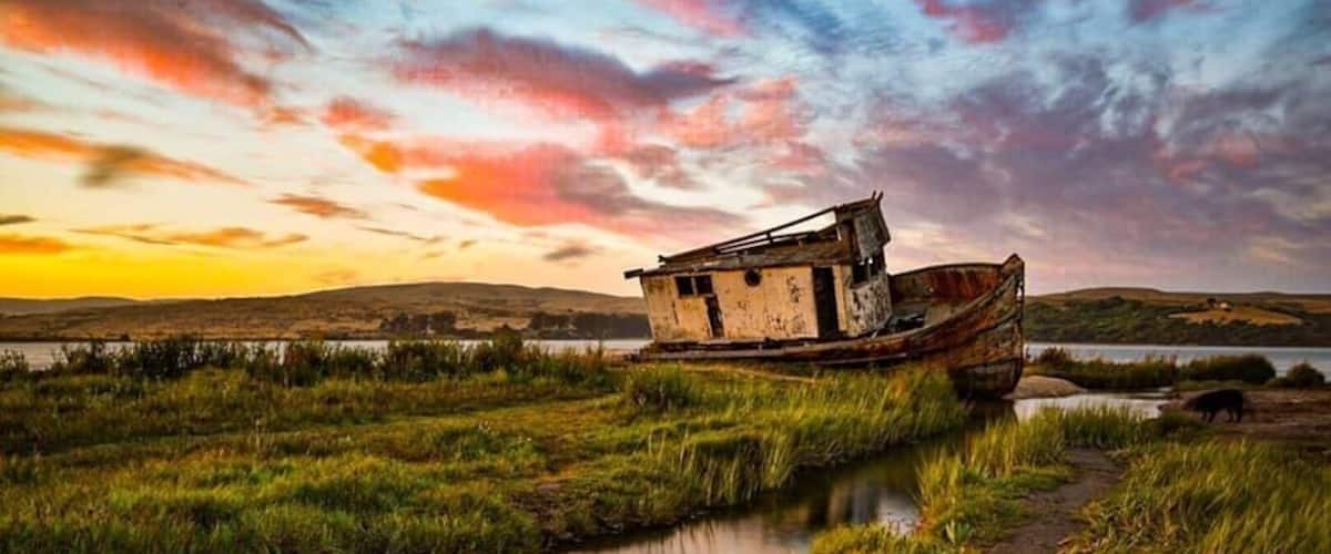 Point Reyes is a prominent cape and popular Northern California tourist destination on the Pacific coast. It is located in Marin County approximately 30 miles west-northwest of San Francisco. The term is often applied to the Point Reyes Peninsula, the region bounded by Tomales Bay on the northeast and Bolinas Lagoon on the southeast. The headland is protected as part of Point Reyes National Seashore. At the southern tip of the peninsula lies the famous Point Reyes Light House, shrouded in fog most of the time!
This was picture is of a shipwreck “Point Reyes” taken at sunset in early July in the wetlands in Inverness, part of the Point Reyes National Park Service, California.
#nature contest