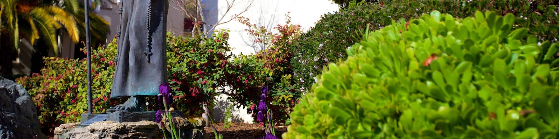 Mission San Rafael Arcangel featuring a statue or sculpture