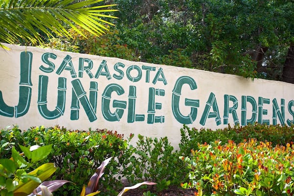Sarasota Jungle Gardens which includes signage and a park