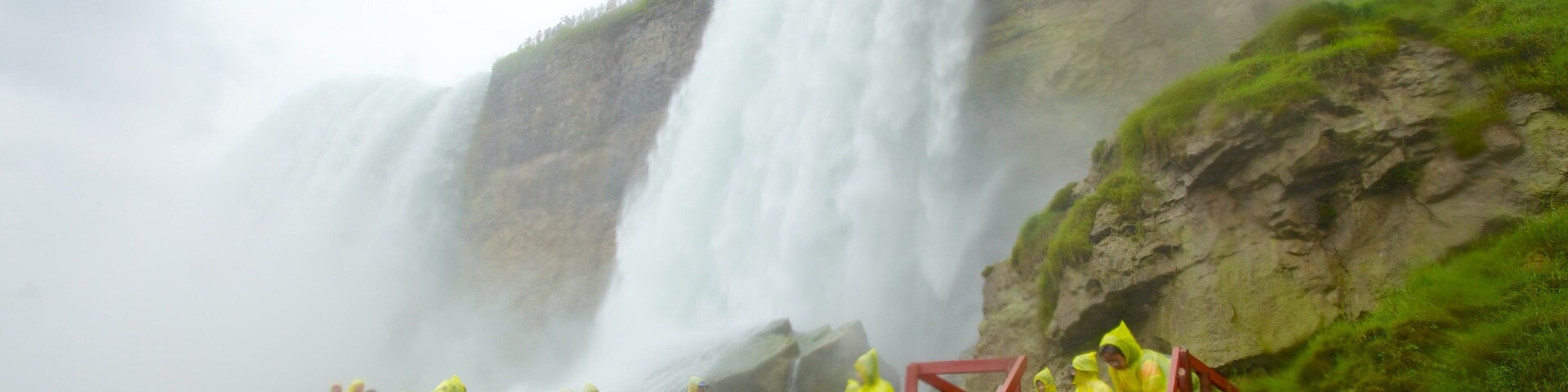 Cave of the Winds which includes landscape views and a cascade as well as a large group of people