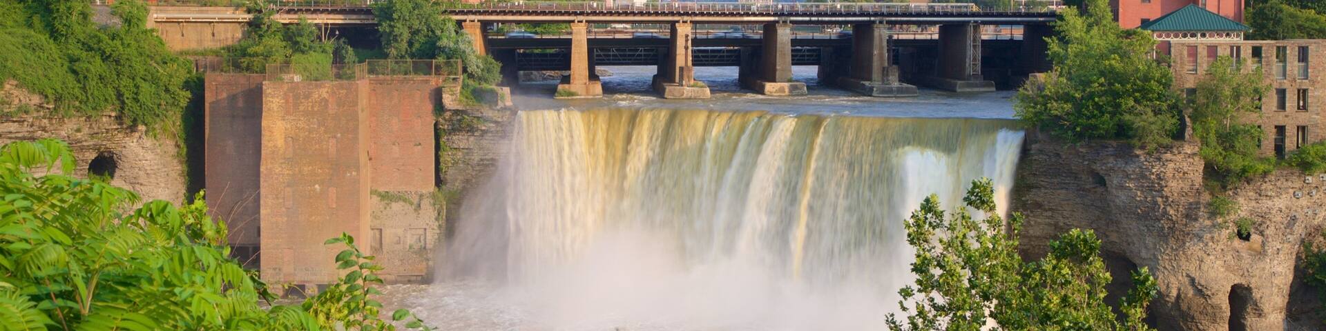 Genesee River\'s High Falls featuring a river or creek, a cascade and a bridge