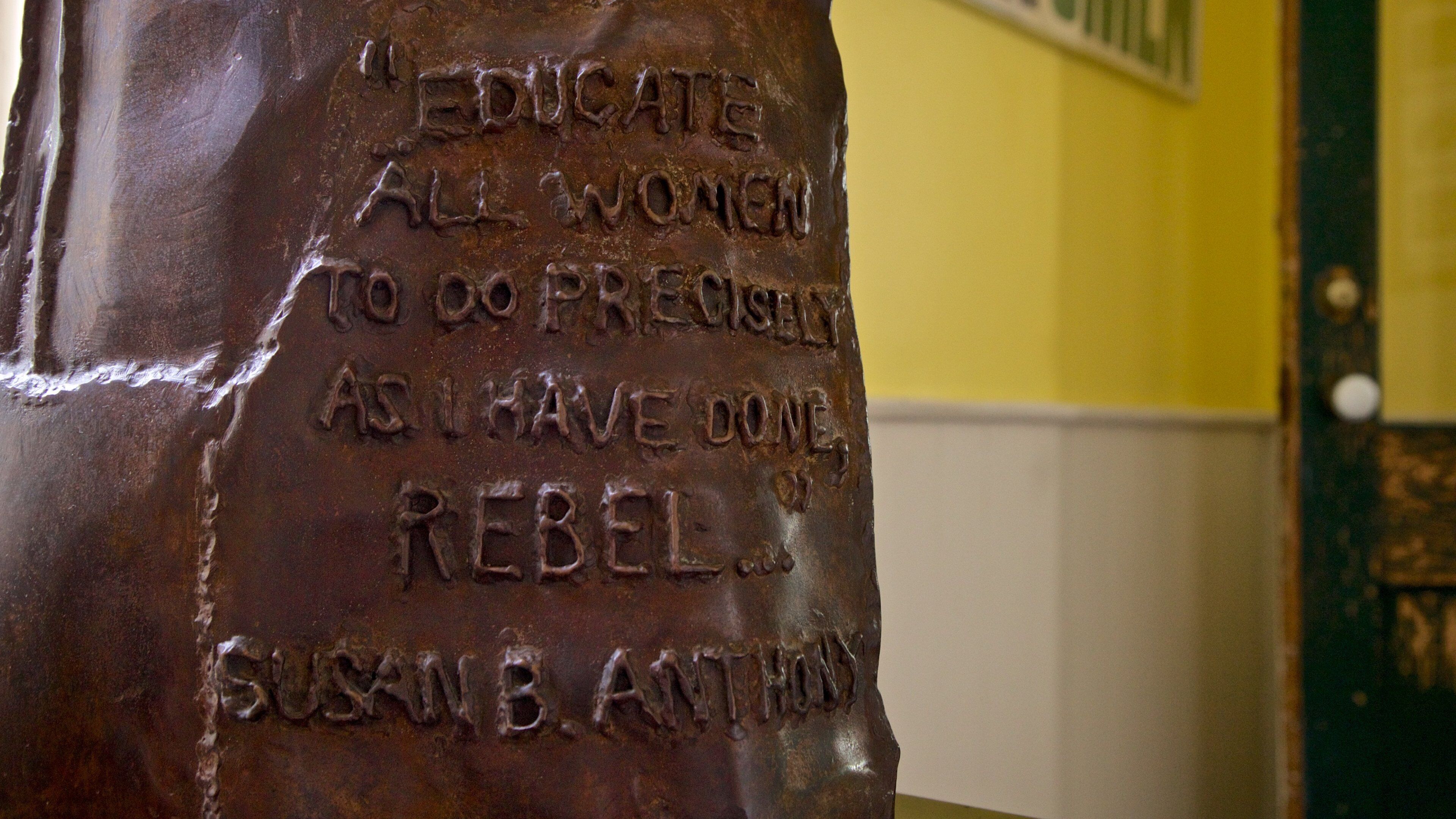 A bronze plaque with an inscription.
