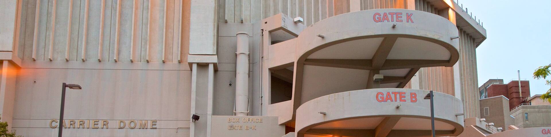 A modern building with steps leading to a box office labeled 'GATE B-K'.