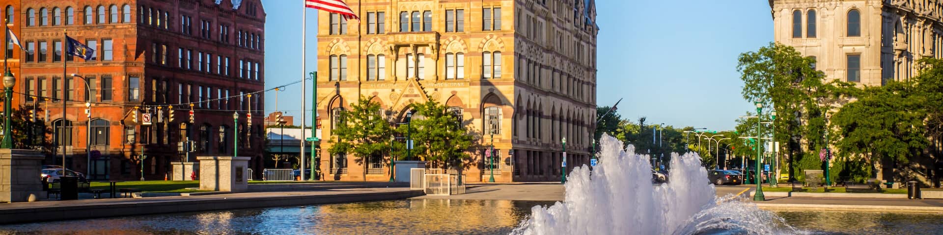 Downtown Syracuse New York with view of historic buildings and fountain at Clinton Square