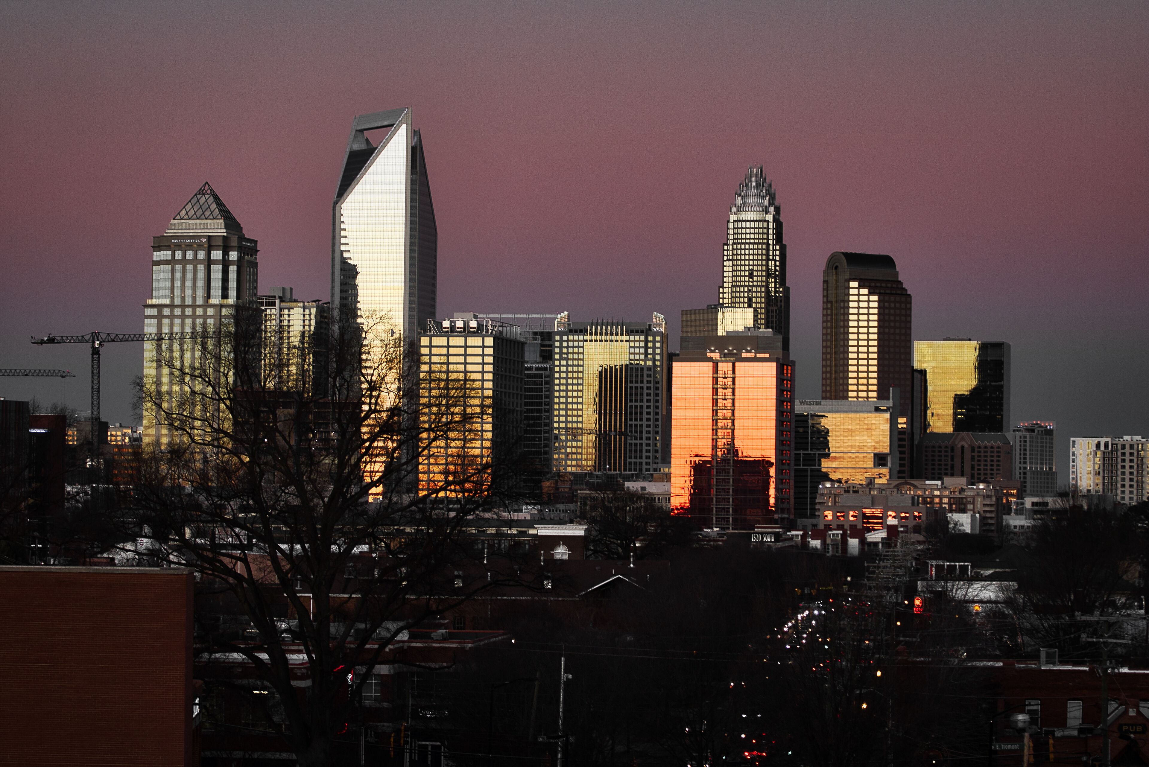 skyline of Charlotte North Carolina at sunset from the west side of the city 