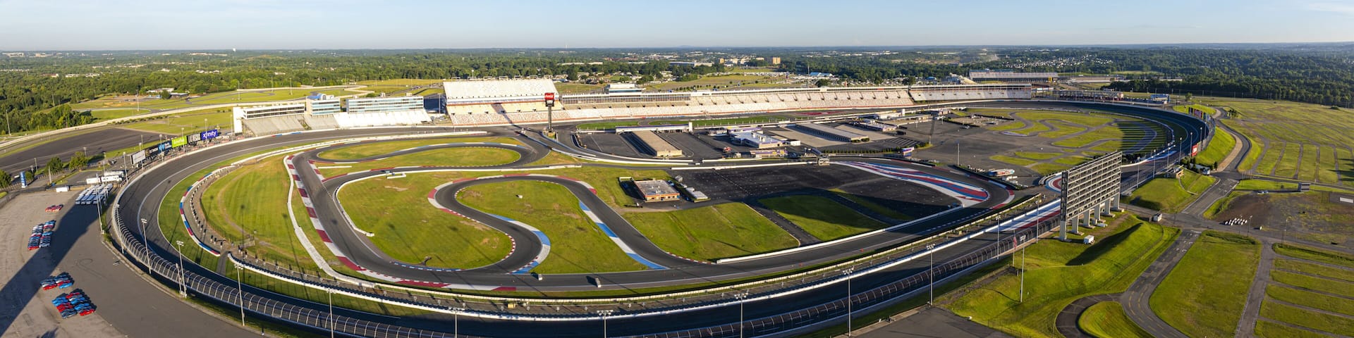 A large, oval-shaped race track with multiple lanes and a grandstand in the background.