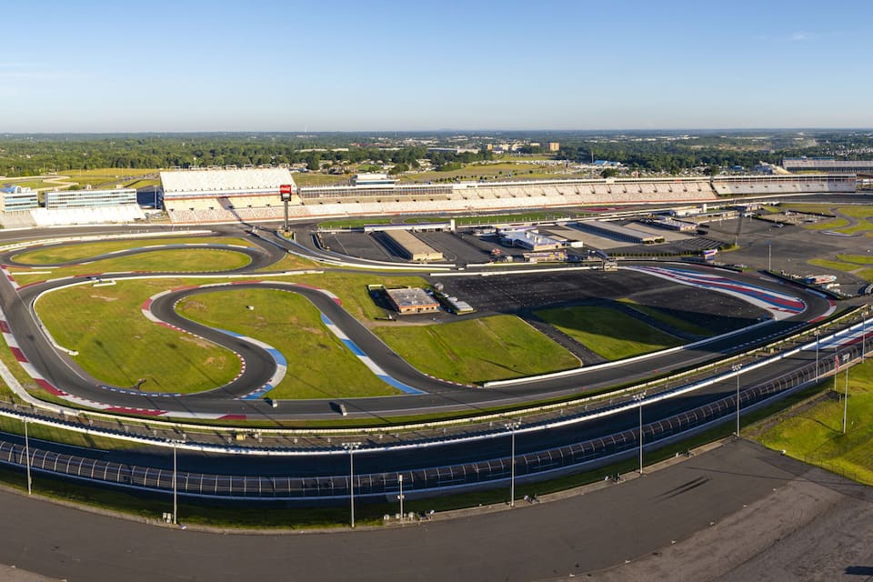 A large, oval-shaped race track with multiple lanes and a grandstand in the background.