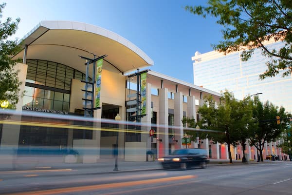 A modern building with a curved roof and a sign that reads "RLOTT CONVENTION CENTER".