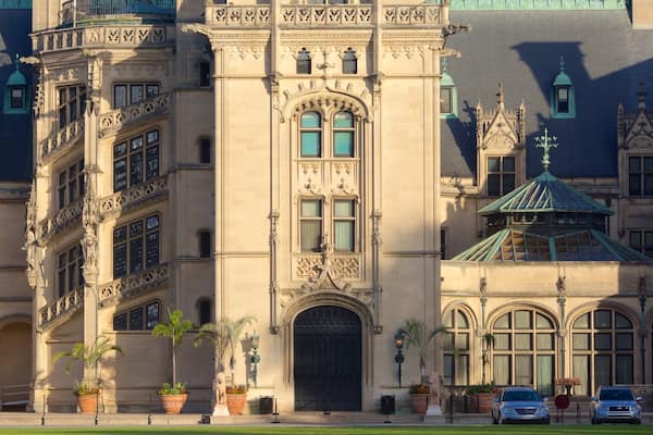 A grand building with ornate architecture, large windows, and a prominent entrance.