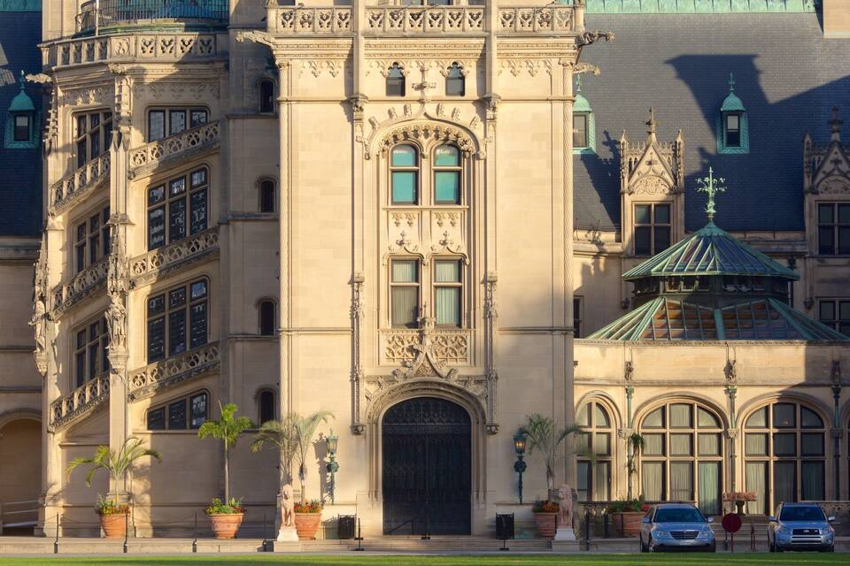 A grand building with ornate architecture, large windows, and a prominent entrance.