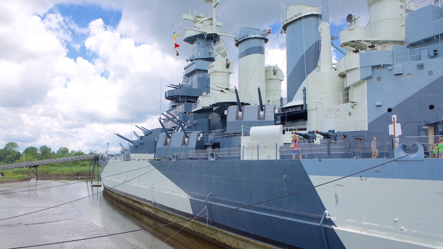 Battleship North Carolina showing heritage elements as well as a small group of people