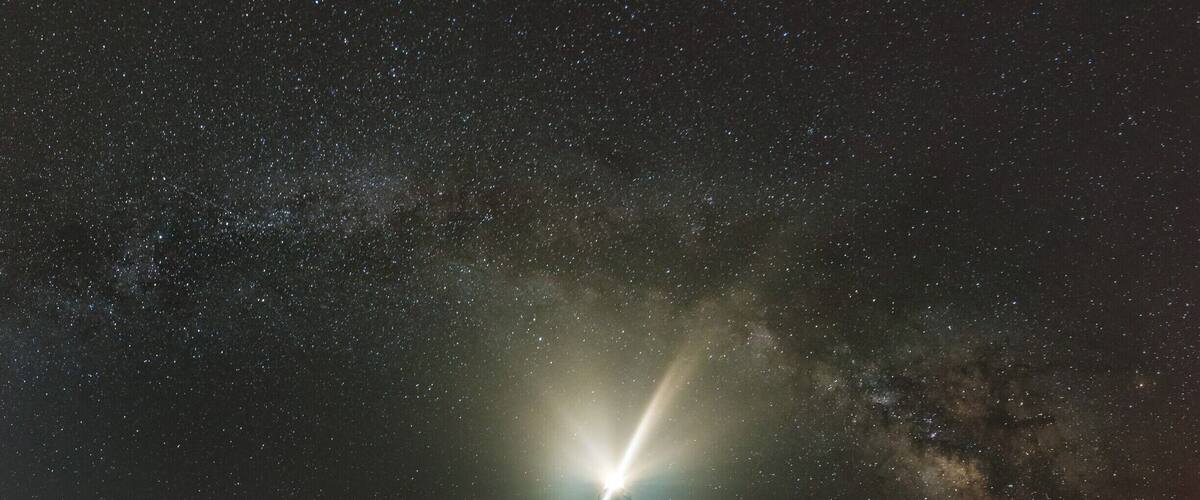 My first attempt at a serious panorama of the Milky Way, our home galaxy. Cape Hatteras Lighthouse provides an ideal location since it faces the right direction to compose such a panorama while maintaining the balance in the image.
This shot is composed of 6 vertical shots shot at 30 degrees of rotation and merged in Photoshop. Added to the usual difficulties of shooting and composing a panorama at night, this night was crazy hot with nighttime temperature in the mid 80s, no breeze and humidity so high that the lens had to be wiped after every exposure. On top of it, the mosquitoes had a field day running rings around me and no amount of bug spray helped. But in spite of all that, I managed to walk away with an image and experience that does appeal to me.