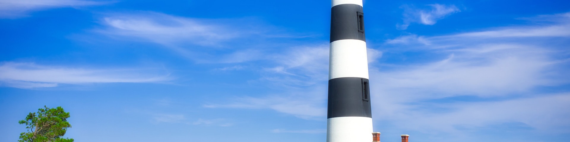 A beautiful summer of the lighthouse at Bodie Island on the Outer Banks in North Carolina. Dreamy beach look.