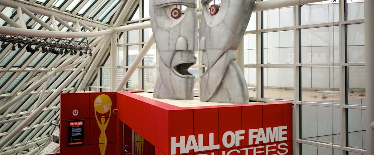 A Hall of Fame inductees display with two large metallic faces and a red base with the Hall of Fame logo.