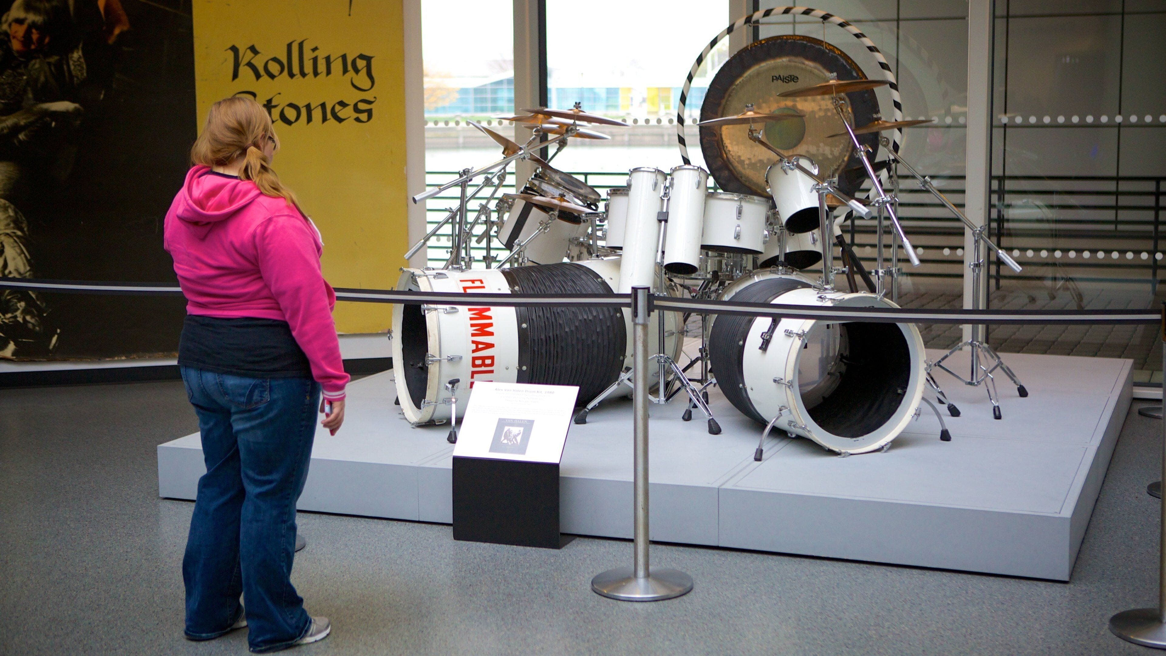 Rock and Roll Hall of Fame showing interior views and music as well as an individual femail